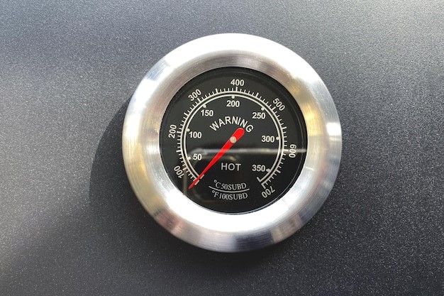 A close-up of a temperature gauge

Description automatically generated